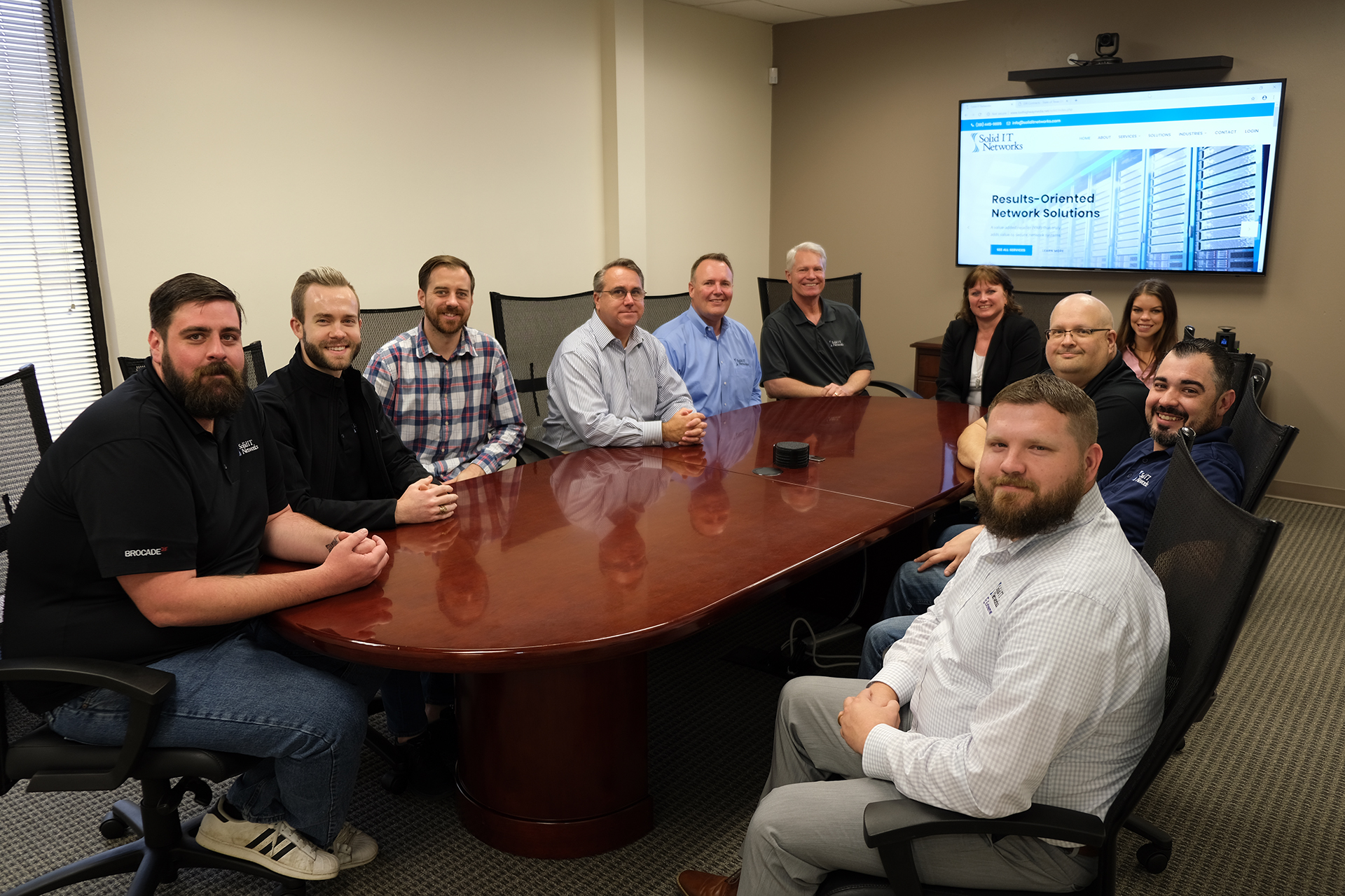 Solid IT Networks Team at Conference Table